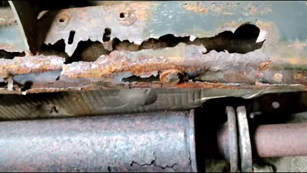 Jeep Wrangler frame rail rotted through with holes